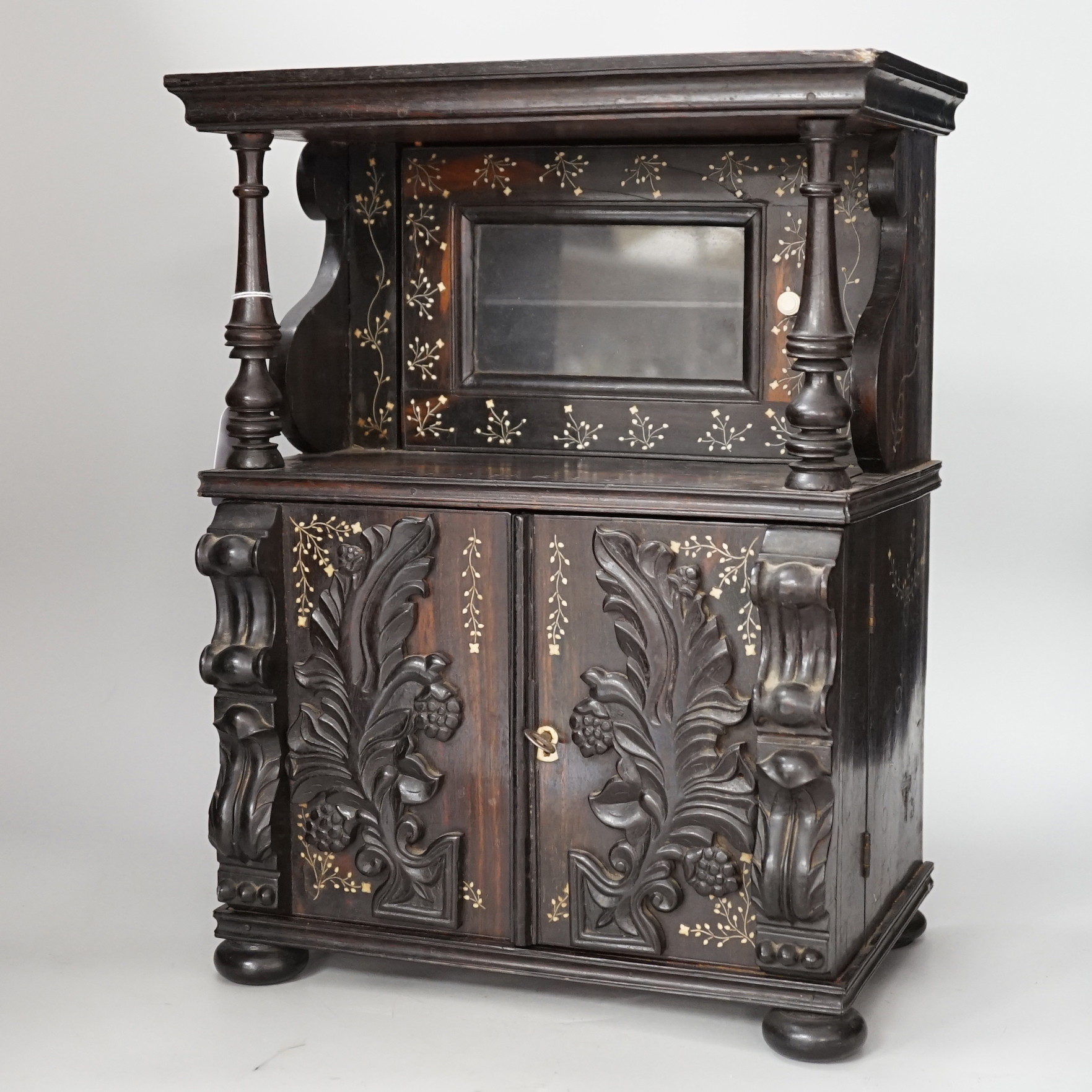 A mid 19th Anglo-Ceylonese ebony and bone inlaid writing box modelled as a parlour cabinet, 29.5cm wide x 40cm high